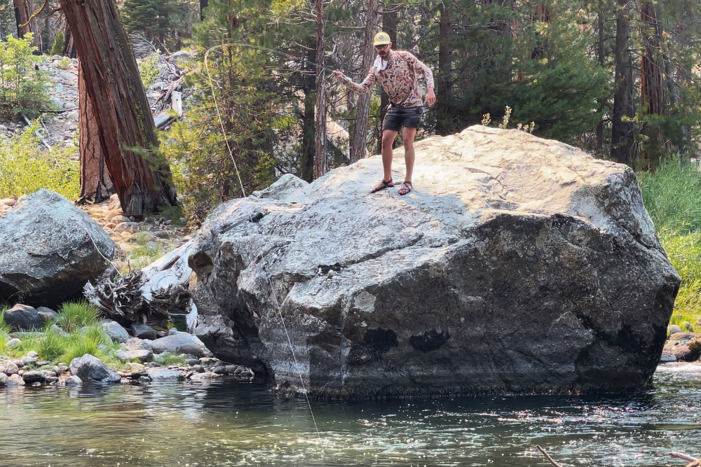 George Revel casting off a rock.